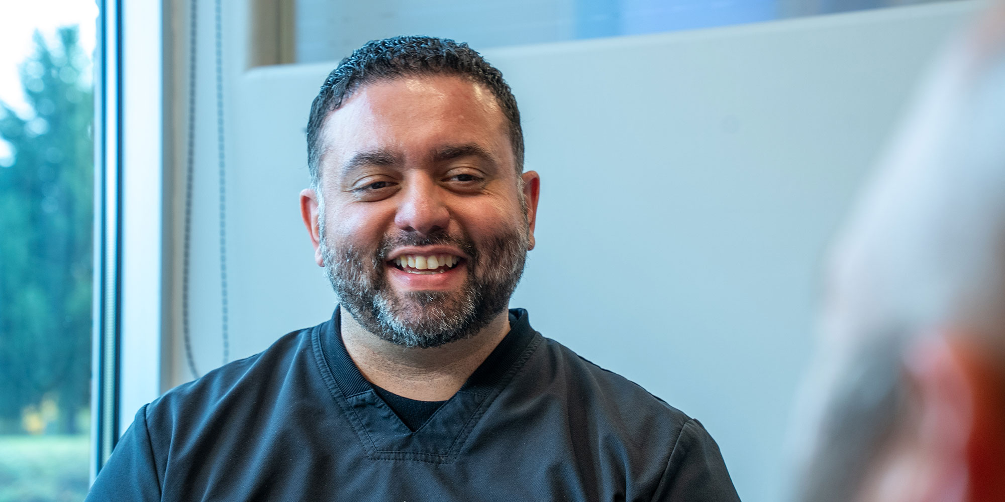 doctor smiling while going over dental procedure information