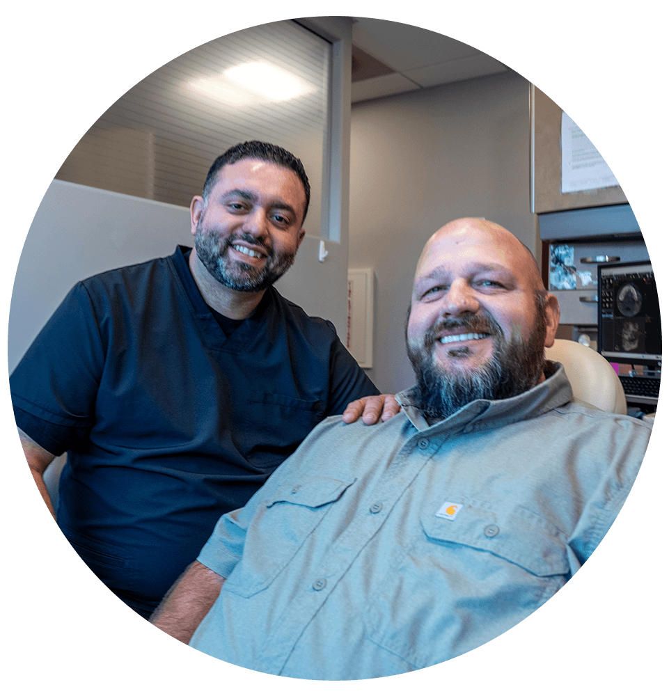 doctor and patient both smiling brightly while at the dental center