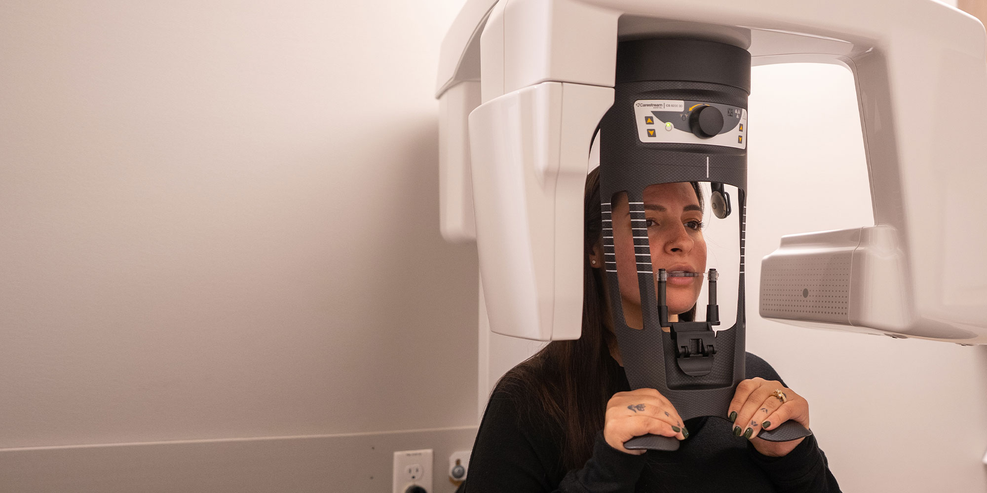 patient undergoing a cbct scan for their dental treatment