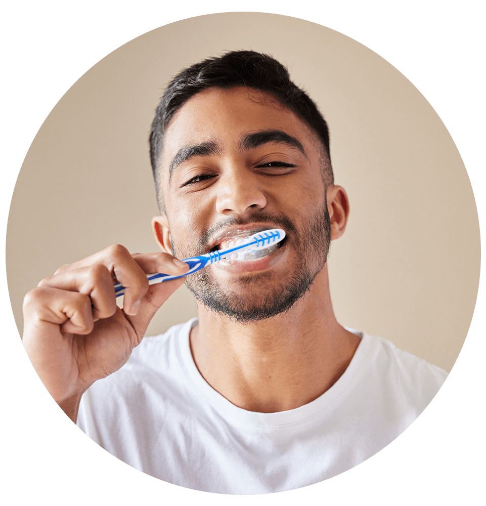 close up of person brushing their teeth